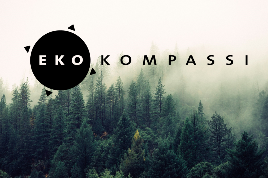 Kuvituskuva, jossa on Ekokompassin logo ja metsää.